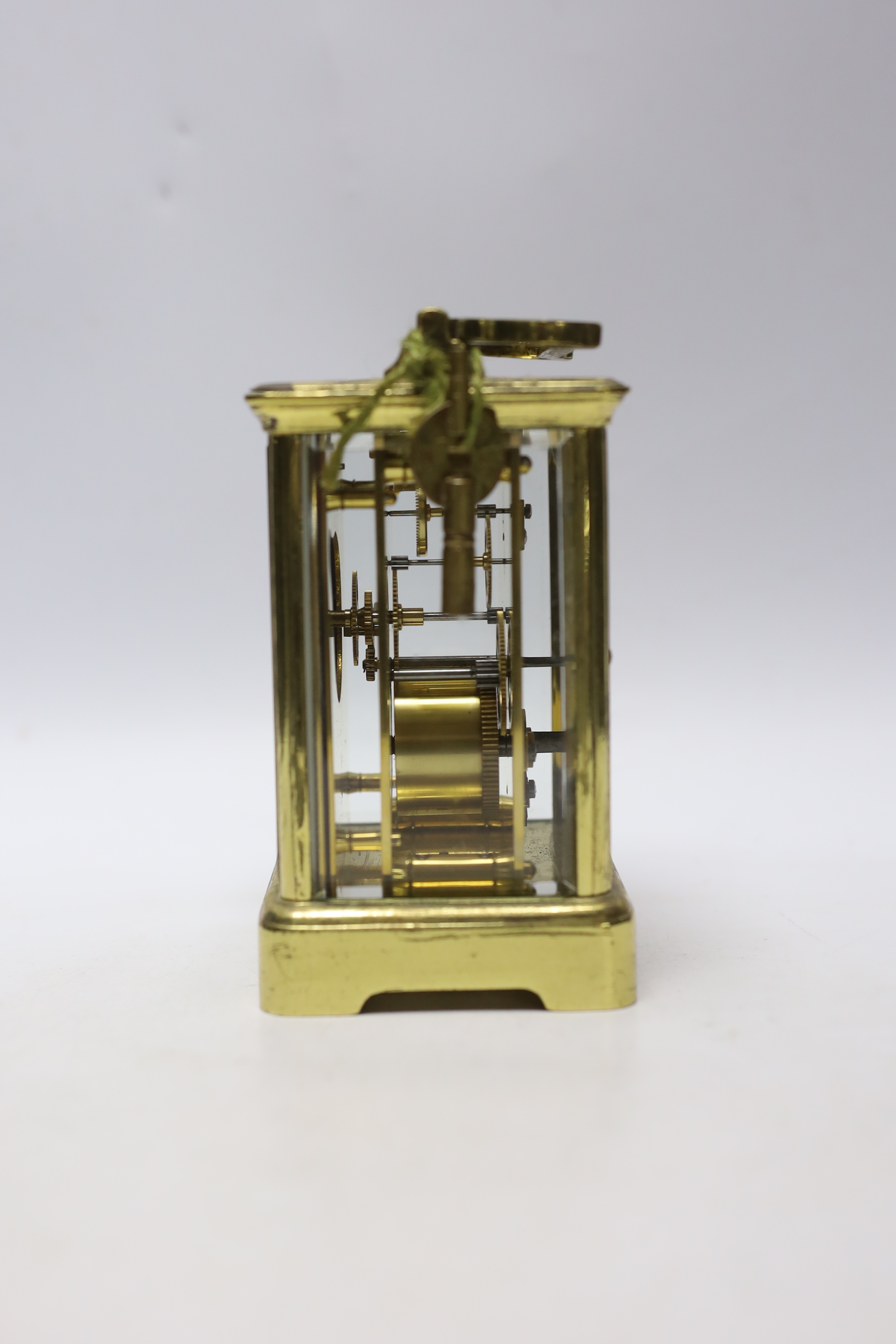 A brass carriage timepiece with enamel dial, 18cm high